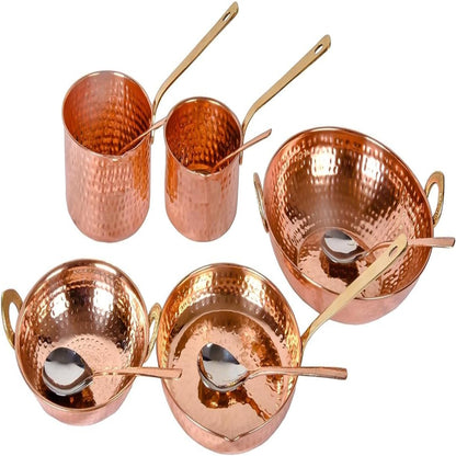 Set of copper cookware with handles and spoons