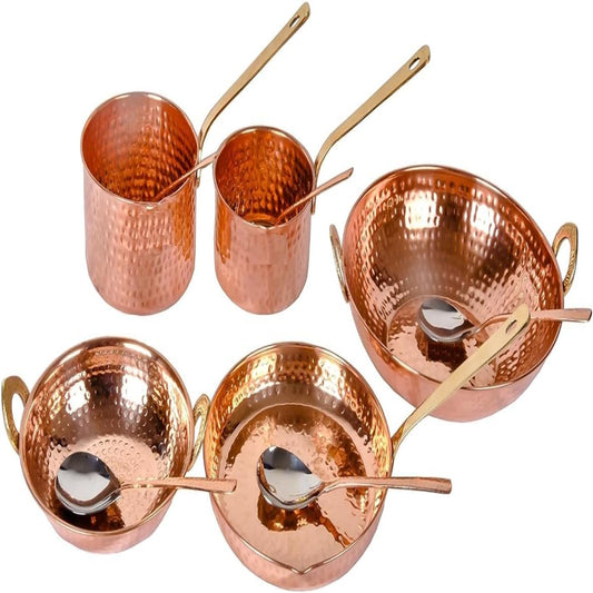Set of copper cookware with handles and spoons